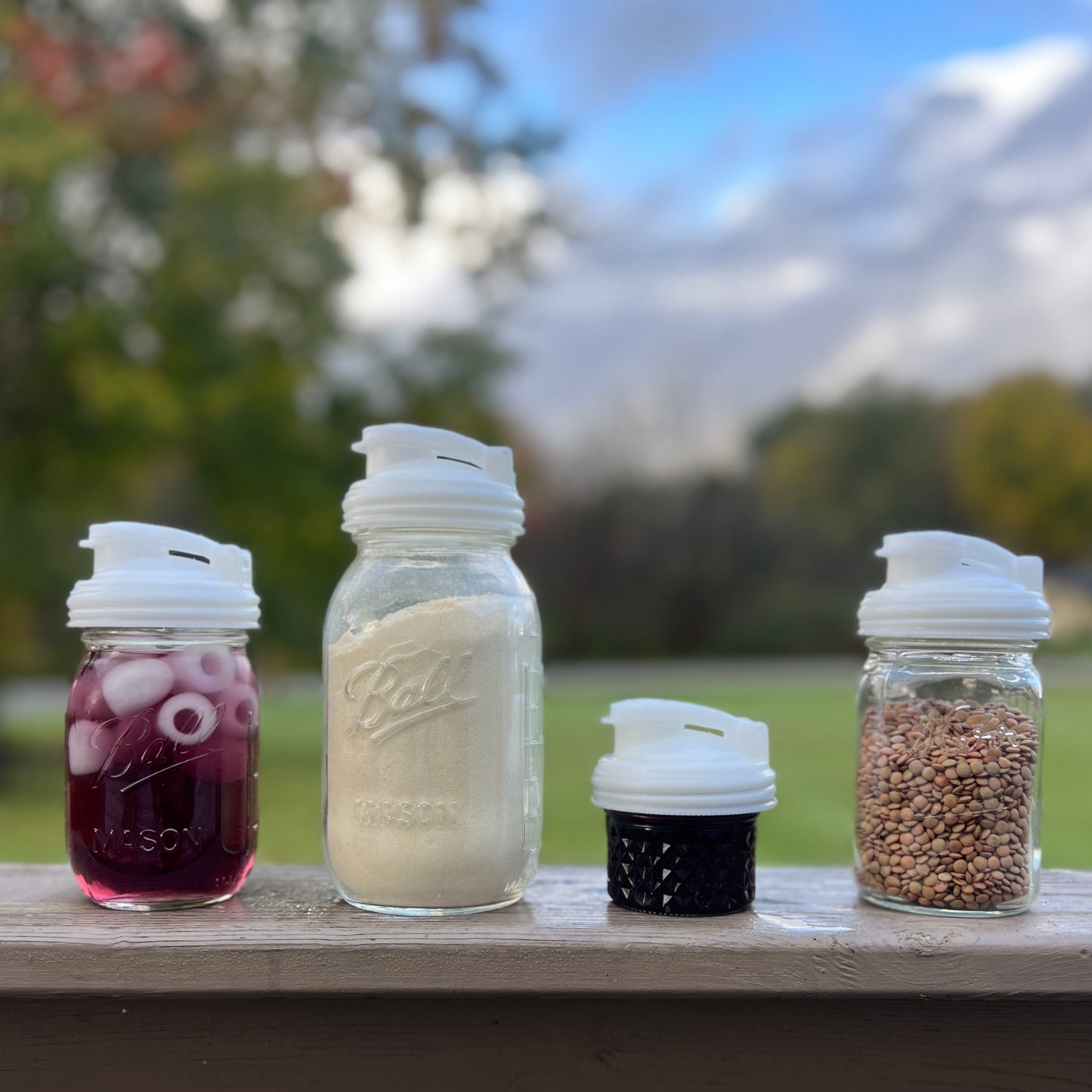 Four White Mason Jar POUR lids.