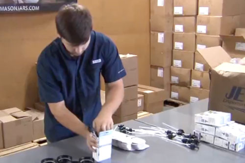 reCAP team member packing Mason jar pump lids