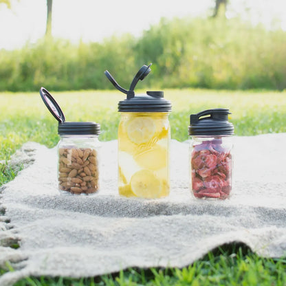 Three Mason Jars, one has a FLIP Top Lid, the other two have POUR lids.