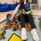 Young girl with dog reading Goin' Explorin'