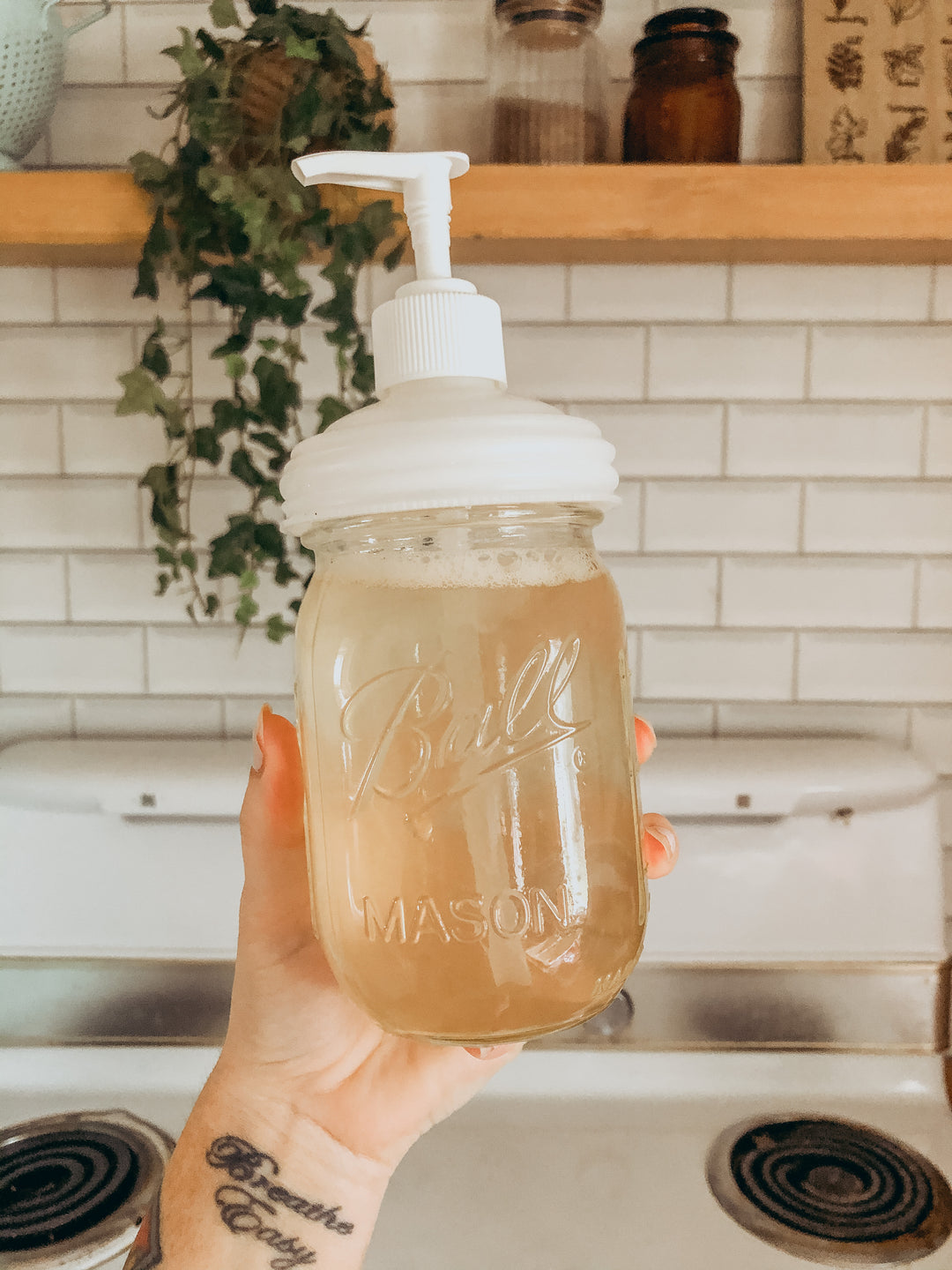 reCAP® Mason Jar Soap Dispenser Lid and pump cap on a regular mouth Mason jar