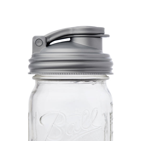 A close up shot of the silver Mason jar POUR lid.